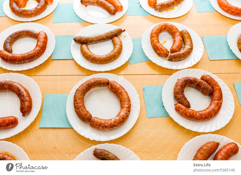 Domestic fresh delicious grilled and fresh handmade sausages on white plate arranged for sausage tournament Aromatic Arranged Assess Baked Bratwurst Caloric