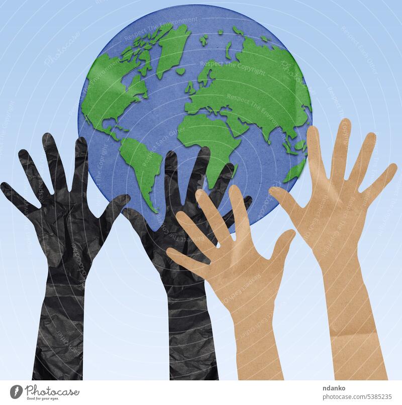 Hands cut out of crumpled paper are raised to the shape of a globe. The concept of environmental conservation, ecology earth world human hand planet people