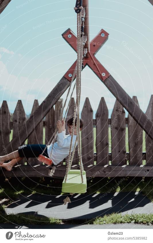 Child on the swing sideways Infancy Joy Boy (child) Youth (Young adults) Exterior shot Day Summer Happiness Happy bullerbü vintage Joie de vivre (Vitality)