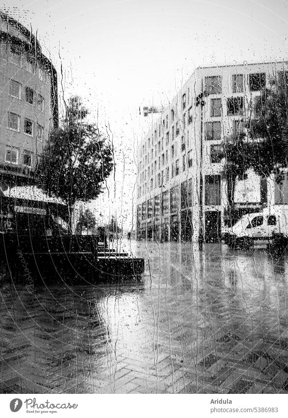 View through window pane | Altona in rain b/w Pedestrian precinct Rain Paving stone Pane Window raindrops blurred Wet Drop Drops of water Window pane Weather