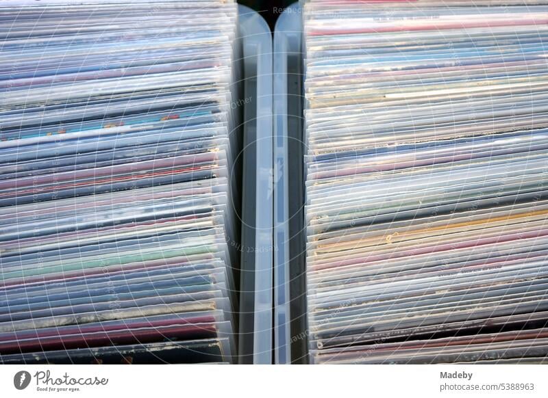 Old vinyl records and long-playing records in transparent plastic sleeves in plastic containers in front of an old record store in the Bornheim district of Frankfurt am Main in the German state of Hesse