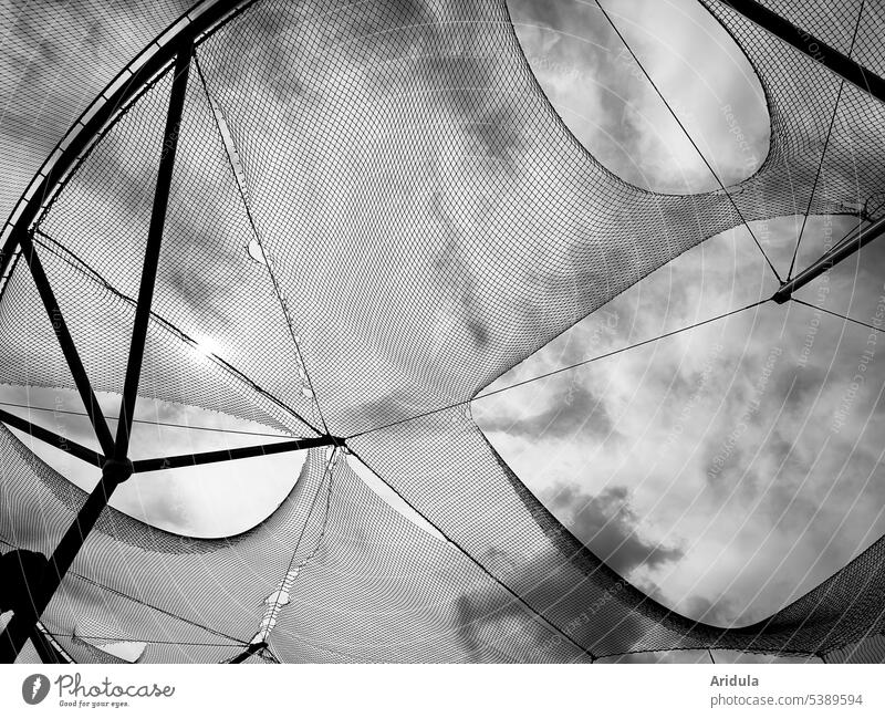 frog perspective | perforated net in front of sky with clouds b/w Net hinmel Worm's-eye view Steel carrier holes Clouds Network Exterior shot