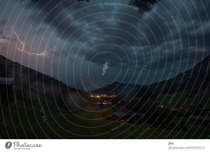 Thunderstorm atmosphere over Gstaad Thunder and lightning lightning bolt Moody Night Dark Clouds Saanenland Weather Storm Night sky Elements Long exposure Sky