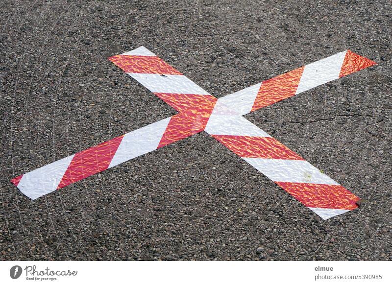 cross pasted on the asphalt from red and white tape Adhesive tape Asphalt Crucifix mark Signal tape Reddish white Warning colour Blog Street Position