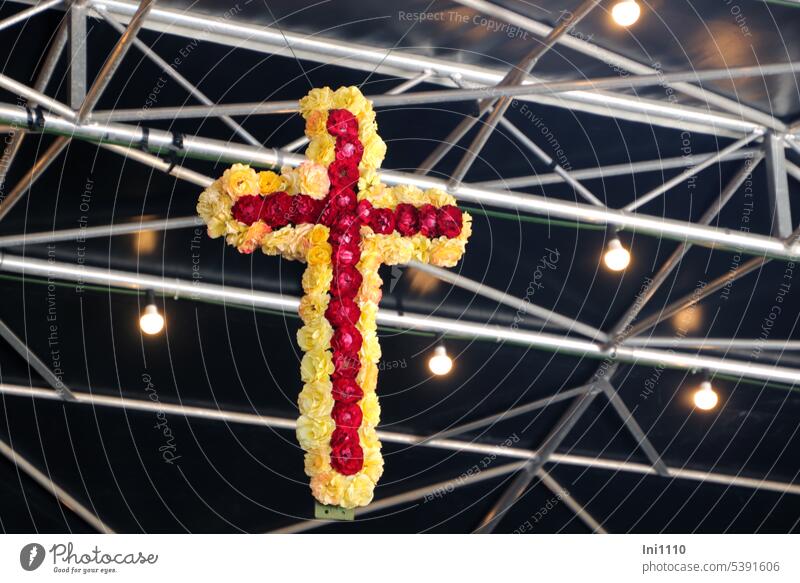 hanging cross decorated with rose petals Christianity religion Church service celebrations Crucifix Jewellery symbol flowers roses Flower arrangement hung