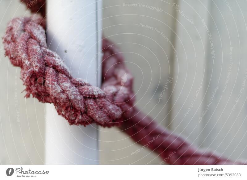 Red ship rope as handrail Ship jam Knot Hand rope Rope Railing. stairs sailor knot