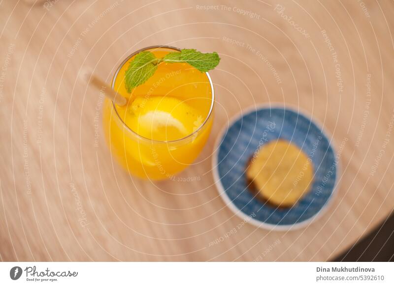 Orange cocktail drink with a cookie. Colorful drink. Hipster style cafe. alcohol alcoholic art background bake bar bartender biscuit biscuits calories
