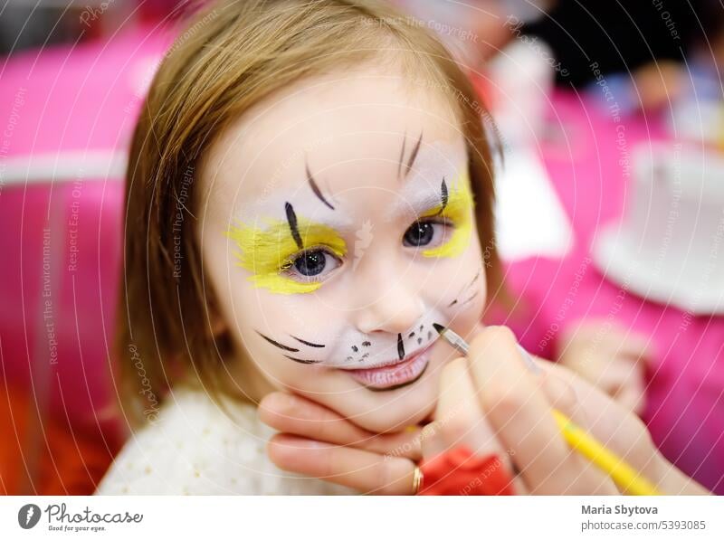Face Painting For Cute Little Gorl During Kids Merriment. Face Paint For  