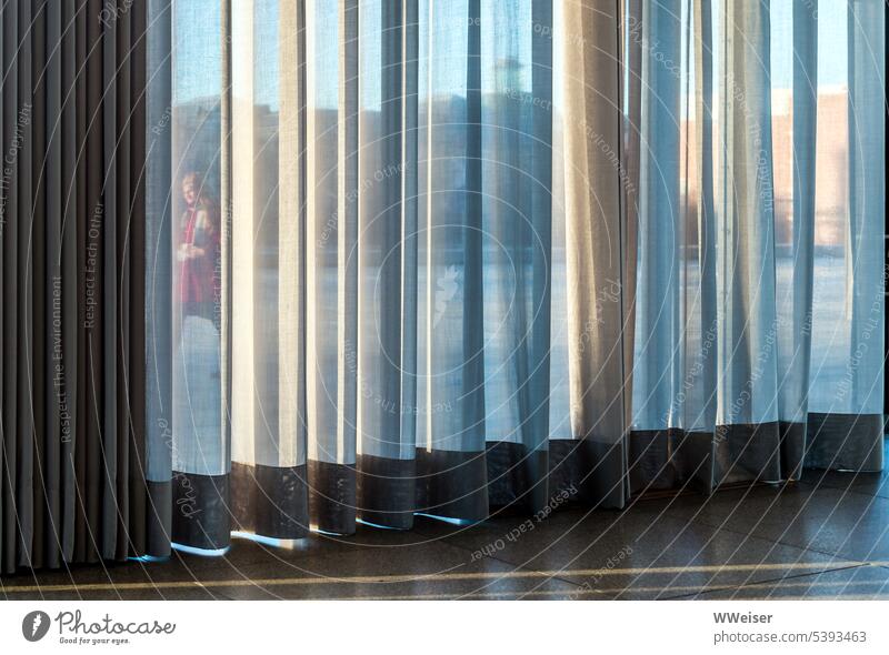 Through the curtain and the big window you can see someone passing by Window Transparent transparent Drape Curtain crease Folds Screening sight Vantage point