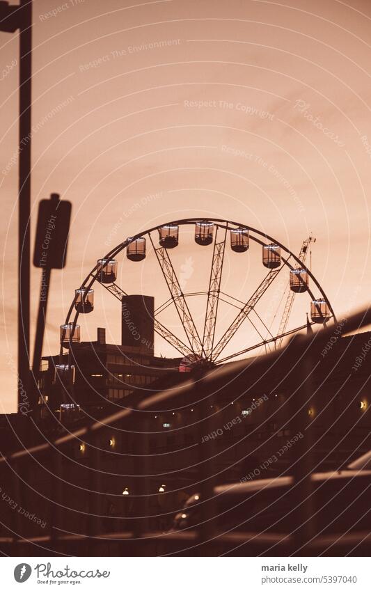 Ferries wheel on amusement park during sunset Round Wheel Ferris wheel Sunset Orange Beach Architecture Ride fun Amusement Park Captured