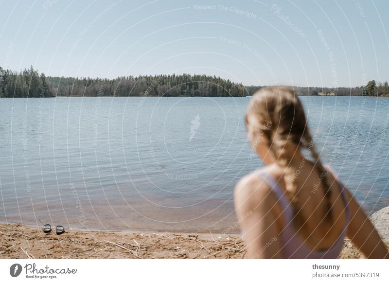 Ice bathing on Lake Sweden Lakeside shallow lake Beach shoes plaited hair be afloat cooling swim in the lake sweden-landscape