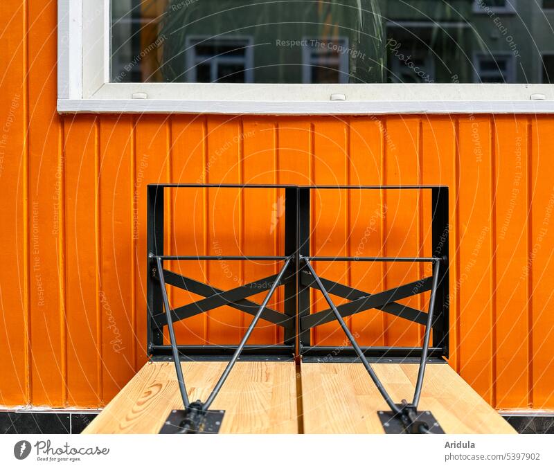 Outdoor catering | Raised beer benches in front of orange wooden wall with window outside gastronomy Gastronomy Restaurant Closed Orange Wall (building)