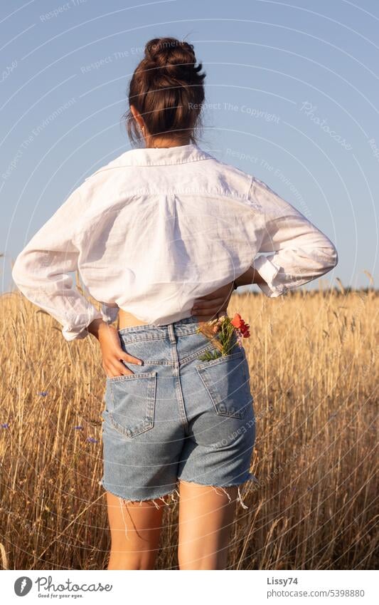 Girl standing on the edge of the field with a bouquet of flowers in her pocket 2.0 Nature Field Margin of a field Summer Grain field naturally natural light