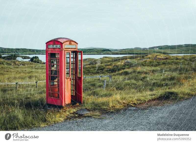 Red cast iron telephone booth on the island of Lewis in Scotland telephone cabin Phone box Harris and Lewis Outer Hebrides make a phone call symbol Europe