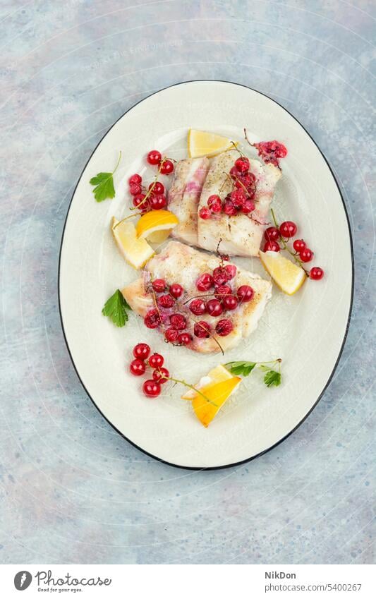 fried cod fillet with berries. fish baked red currants seafood white fish halibut dish plate grilled healthy cod fish lunch flat lay top view roasted eating