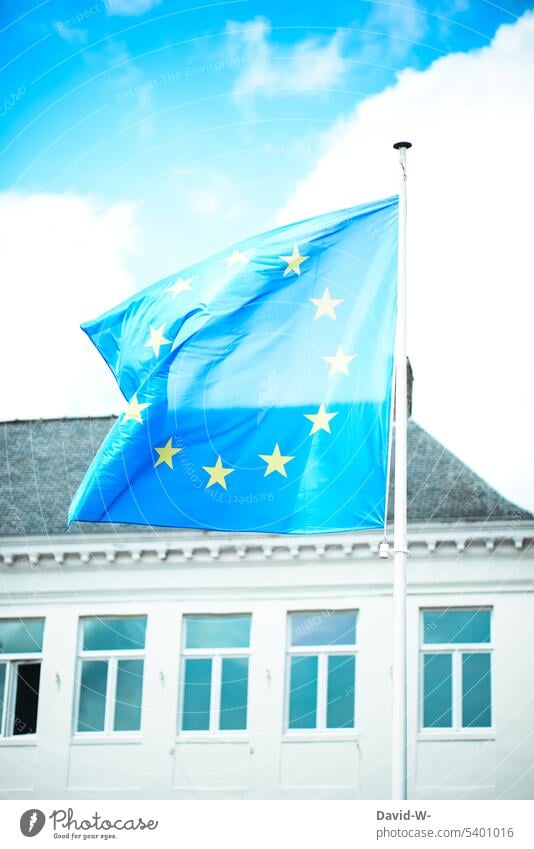 European flag flying in the wind Blow Wind united Flag stars Blue Building Sky EU Politics and state European Union Flagpole