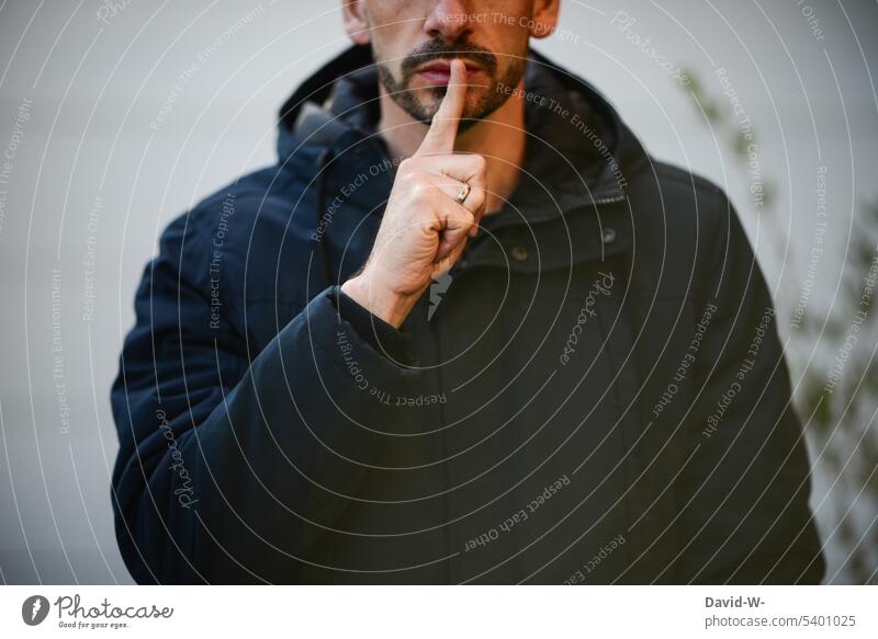 Shh - be quiet - man with finger in front of mouth To be silent tranquillity invitation Fingers Mouth shush Lips Man Anonymous