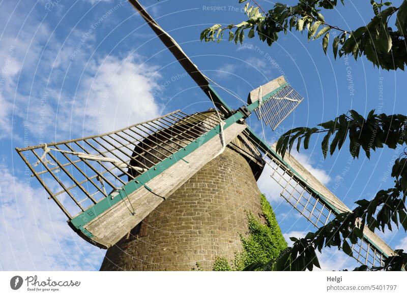 historical windmill in front of blue sky with clouds Windmill Wallholland windmill Old Historic Manmade structures Architecture Windmill vane Worm's-eye view