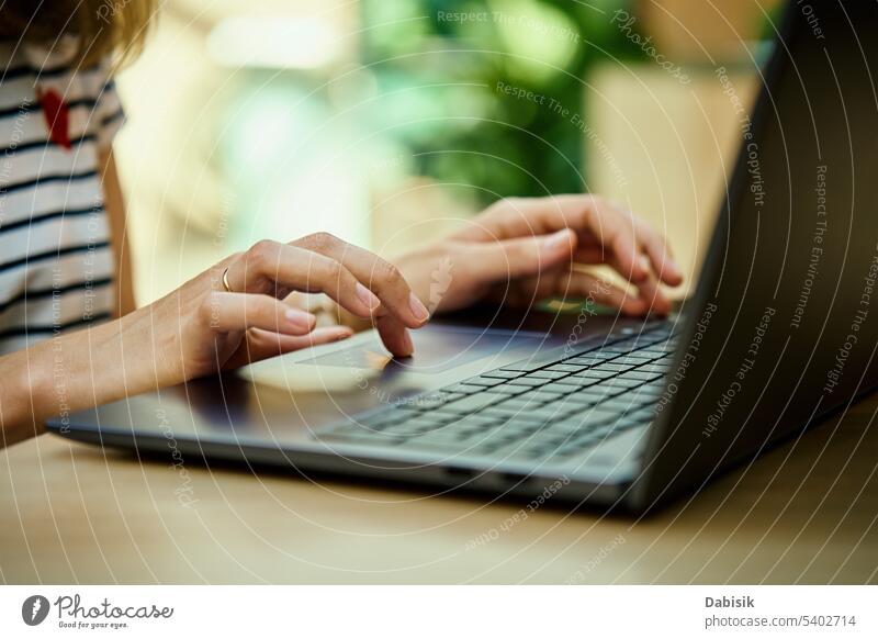 Female hands typing on laptop keyboard. use woman freelancer online business office working workplace remote people technology computer table communication