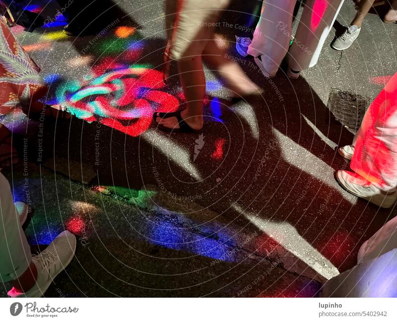 Colorful disco lights on the floor and feet of party guests Disco lights colorful Ground hope Night Summer Backyard Legs standing detail