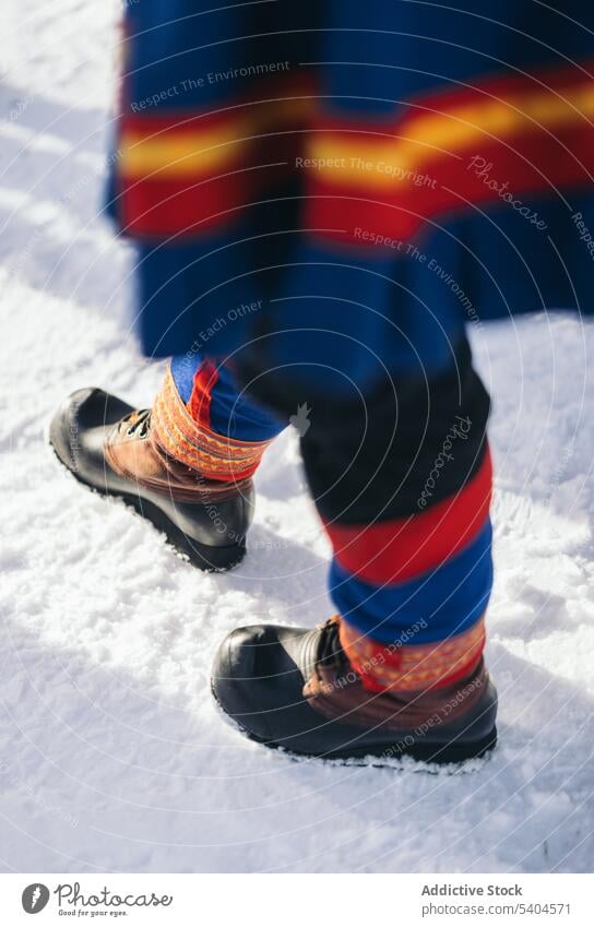 Anonymous person in kofte winter authentic indigenous snow gakti forest countryside native costume season cold frost wintertime weather boots cool cloth local