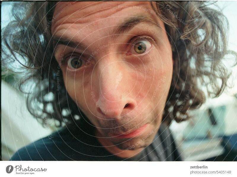 portrait Man Human being Face Grimace grimace Looking eye contact Eyes Eye contact Nose Mouth hair Curl Marvel astonishment Fright Scare Funny Wide angle