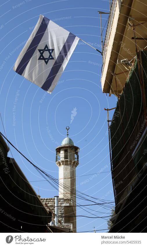 Old City of Jerusalem (Israel). Israel flags hang on a building, behind it the minaret of a mosque. travel Tel Aviv West Jerusalem Old town Flag Flags National