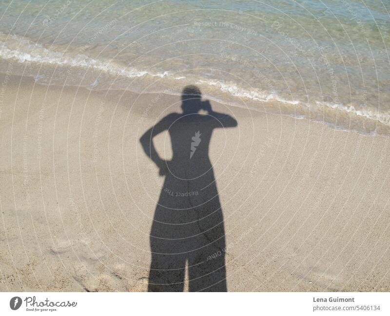 Shadow with head in water person Sand Ocean Sun Water Summer people Woman travel vacation Beach Blue Water's edge Selfie