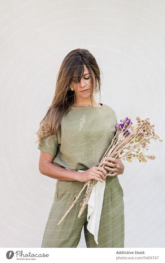 Young woman with bouquet of lavender flowers aroma gift aromatic bunch pensive thoughtful floral fragrant calm plant bloom lady young female scent botany