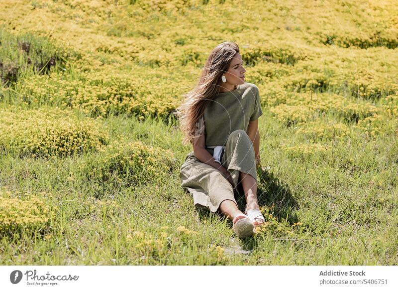 Dreamy woman with resting on grassy meadow dreamy relax field thoughtful nature enjoy countryside female young peaceful casual tranquil serene lawn lifestyle