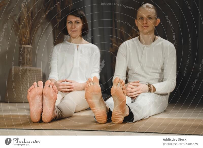 Couple with prints of sadhu board couple husband wife yoga nail practice relax at home yogi asana pose mark foot chakra stimulation acupuncture massage