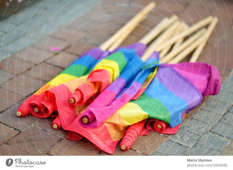 Rainbow flags laying on the ground during the Lgbt Pride Parade. Fighting for equality of sexual minorities. lgbtq pride parade rainbow banner protest activist