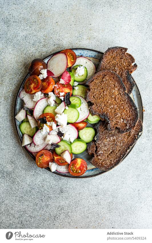 Vegetable salad with toast vegetable bowl radish tomato spice green feta cheese healthy food plate organic composition diet eat vegetarian mix slice fresh
