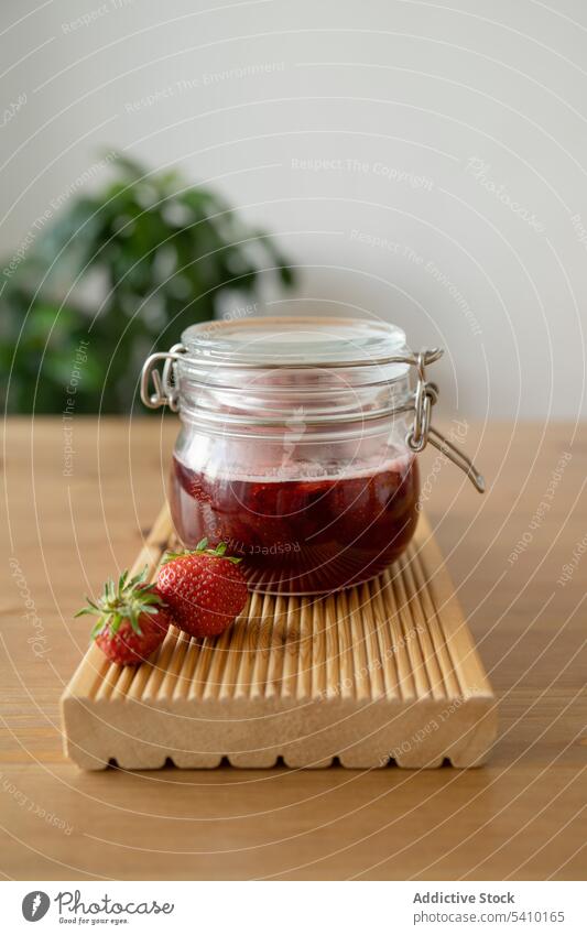 Jar with ripe strawberry on wooden board juice bottle prepare tasty delicious jam table kitchen breakfast healthy fresh casual sweet homemade glass cook yummy