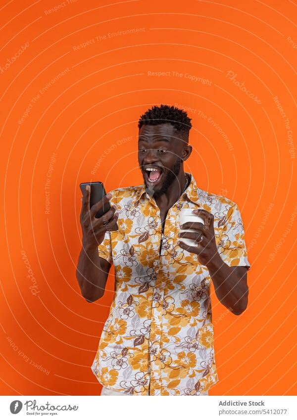 Black man with smartphone and cup of coffee selfie using afro cheerful moment memory smile take photo happy cellphone mobile device curly hair positive