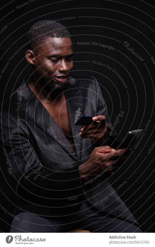 Black man move on smartphone credit card phone call talk using communicate conversation gadget device male mobile connection modern cellphone contemporary