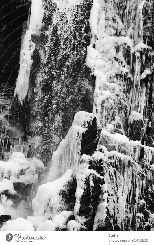 Waterfall with ice forms in Iceland waterfall neckline shape Ice molds Icelandic Abstract Frozen iceland trip East Iceland Snow and ice Figures natural forms