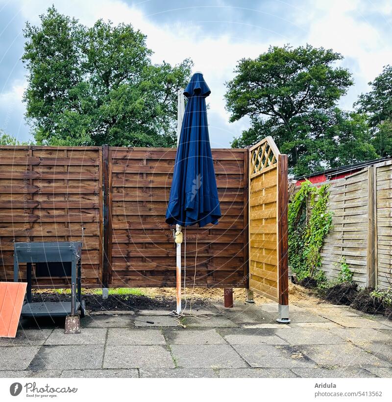 Blue parasol in the barbecue corner Barbecue (apparatus) Sunshade Terrace Deserted Fence Flat wall Exterior shot