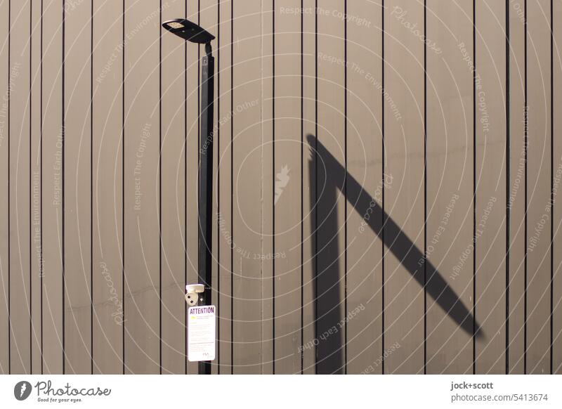 stylish street light casts modern shadow Street lighting Drop shadow Silhouette Sunlight Structures and shapes Contrast Shadow play Seam Line Wall (building)