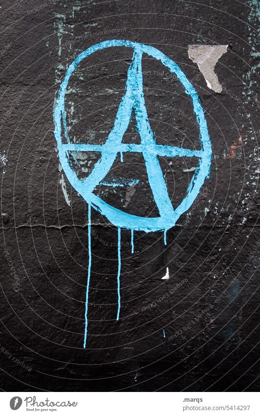 A Graffiti Anarchy Sign symbol Wall (building) Punk Revolution Chaos anarchic urban Spray Painted Grunge Freedom Art anarchist Colour Culture politically Shabby