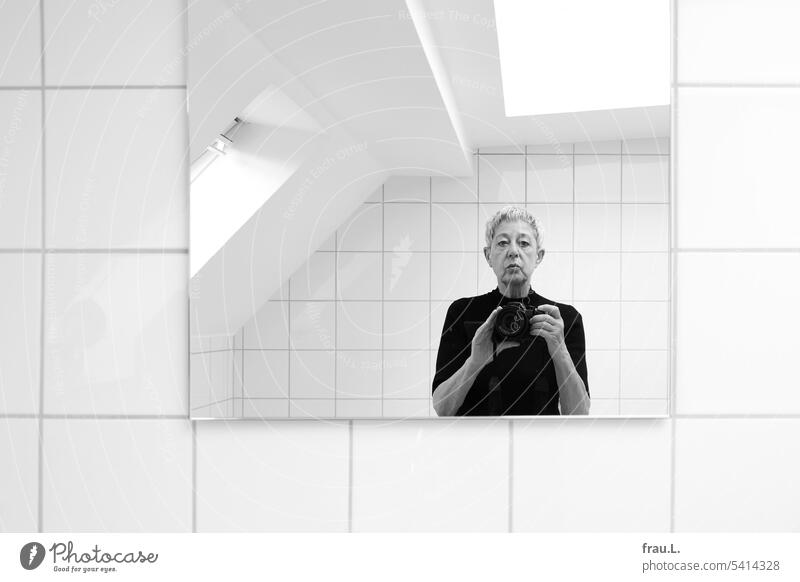 in the bathroom Old Face portrait Selfie photographer Woman Adults Mirror tiles Window Skylight Bright camera Camera