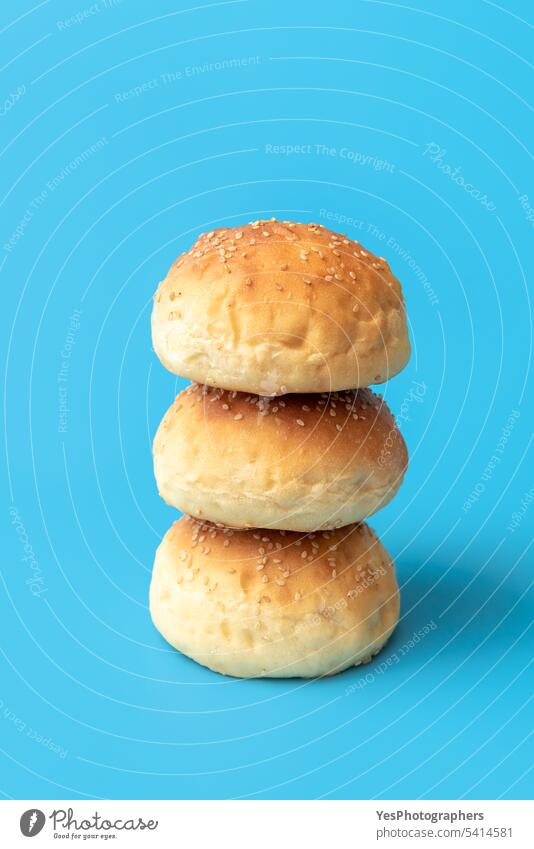 Burger buns isolated on a blue background. Homemade bread buns baked bakery balls breakfast bright burger cheeseburger close-up color crust cuisine cut out