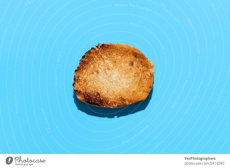 Toasted bread slice above view on blue background. Baguette bread toasted appetizer baguette bakery breakfast bright color copy space crispy crust cuisine cut