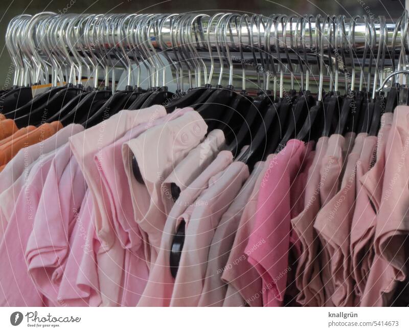 https://www.photocase.com/photos/5414673-pink-t-shirts-t-shirt-clothing-hanger-fashion-photocase-stock-photo-large.jpeg