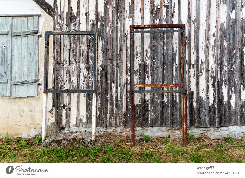Lack of content void blank metal frame display Frame advertising media house wall Old Weathered wood panelling Wall (building) Deserted Exterior shot