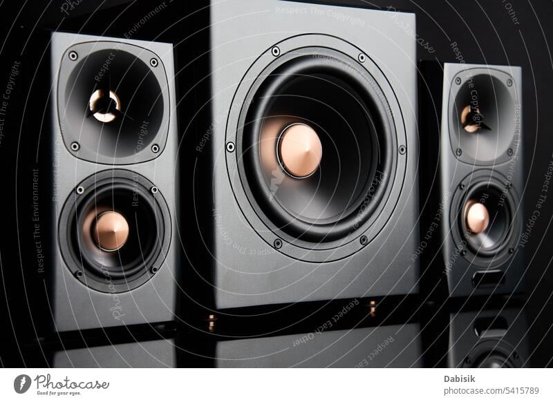 Sound audio system with two satellites and subwoofer on dark background. speaker stereo music loudspeaker dynamic sound acoustic multimedia bass black party