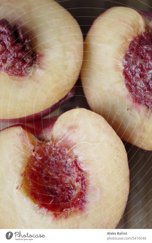 Nectarine halves with and without core nectarines halved Sliced with core Without core Fruit Food cute fruit Juicy Delicious Fresh Mature Red Fruity Nutrition