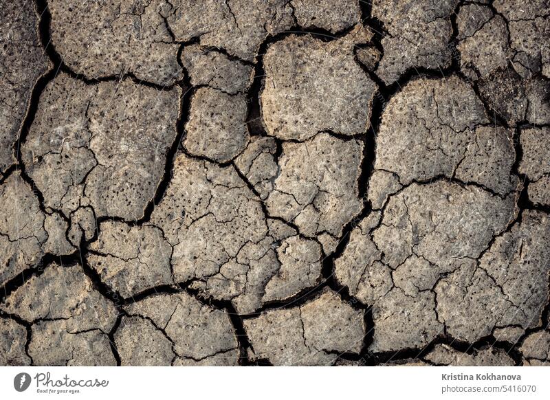 Dry cracked surface, parched land. Earth, dirt, texture background. Ground. abstract barren black broken brown clay climate climate change closeup damage dead