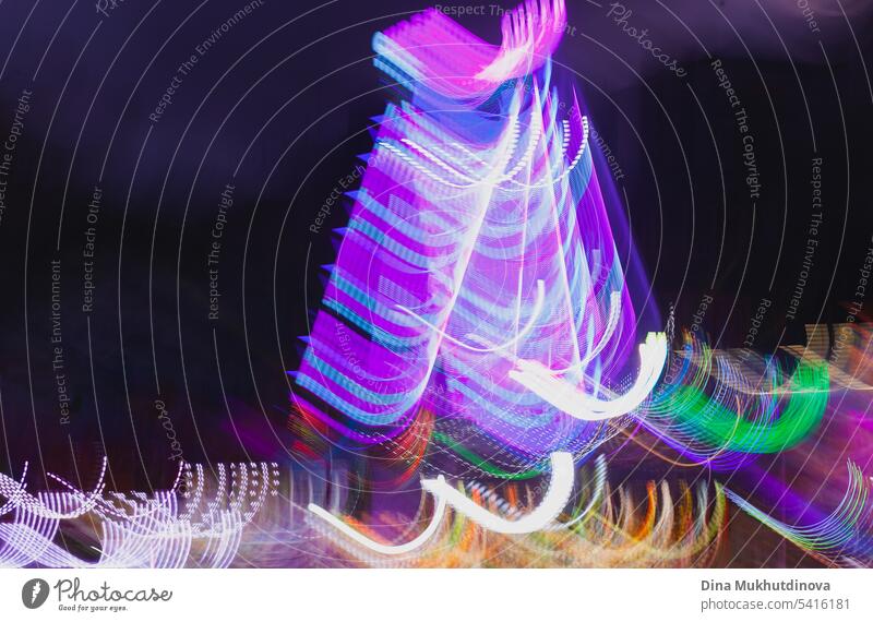 Neon motion blur nightlife abstract backdrop. Amusement park rides a night illuminated with bright lights. amusement park neon carnival travel sky ferris july