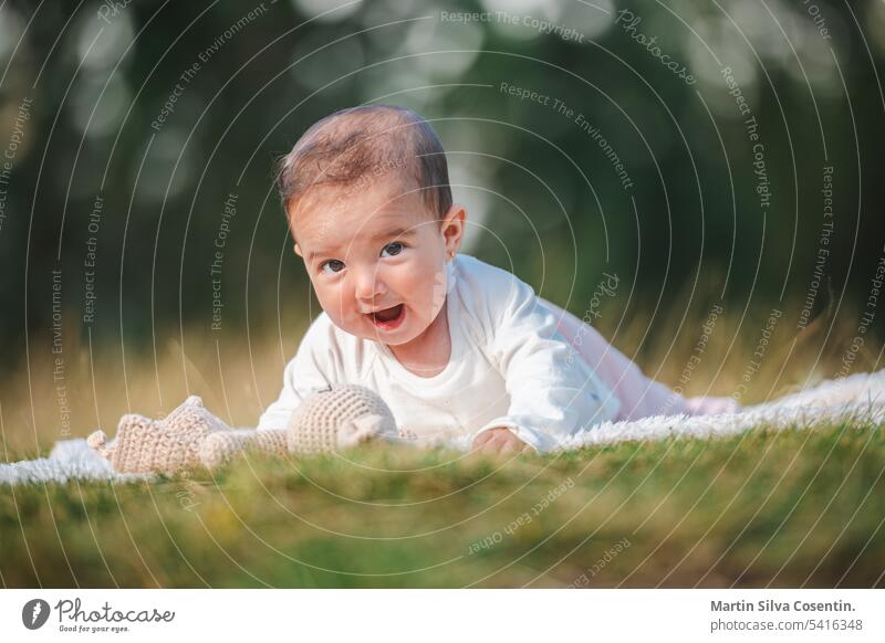 Portrait of a 6 month old baby in the woods. 4-6 month babyhood background beautiful boy caucasian child childhood cute face family female fun girl grass green